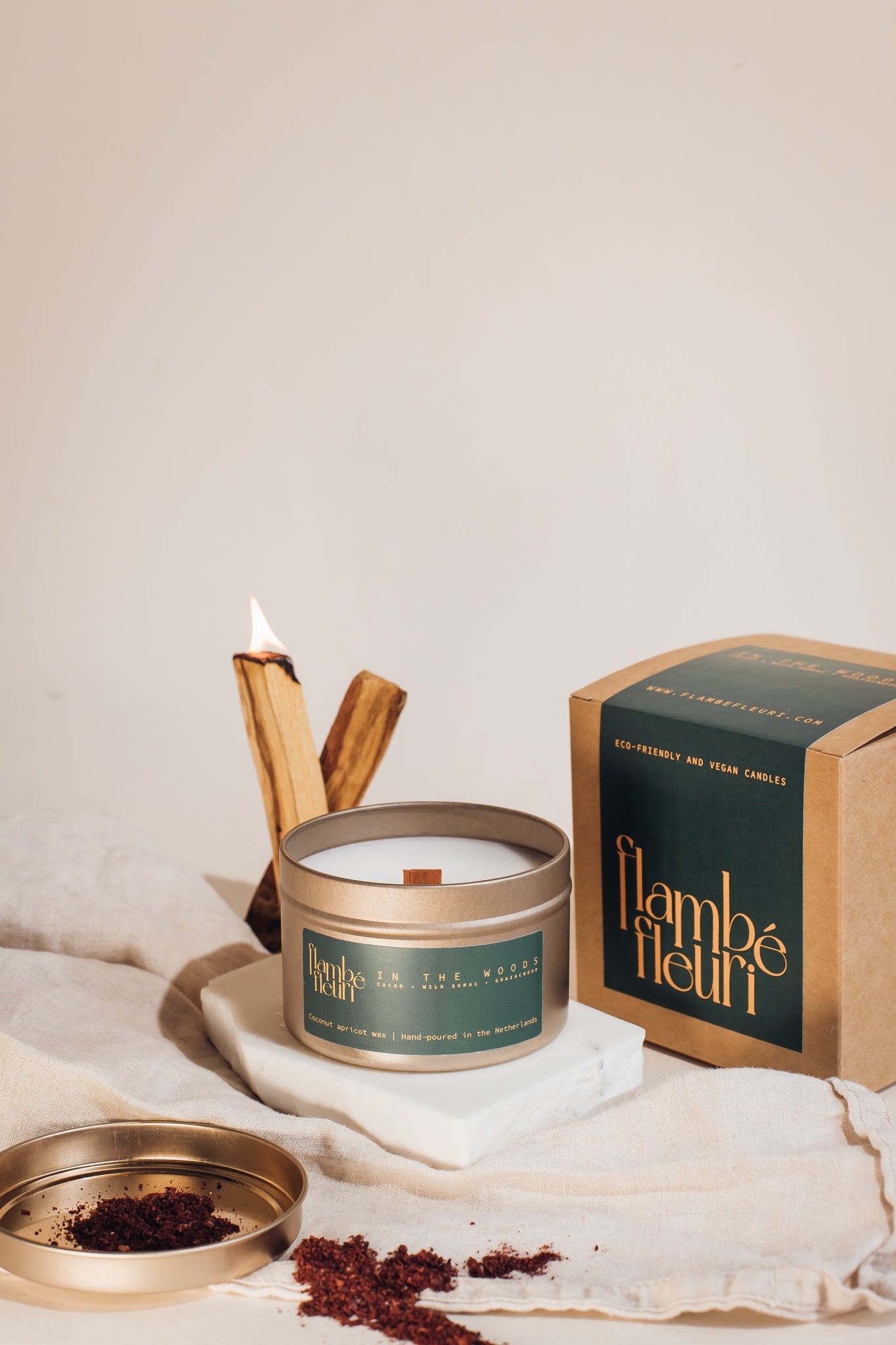 Non toxic vegan Candle with packaging and wooden sticks on a neutral background. wooden wick 